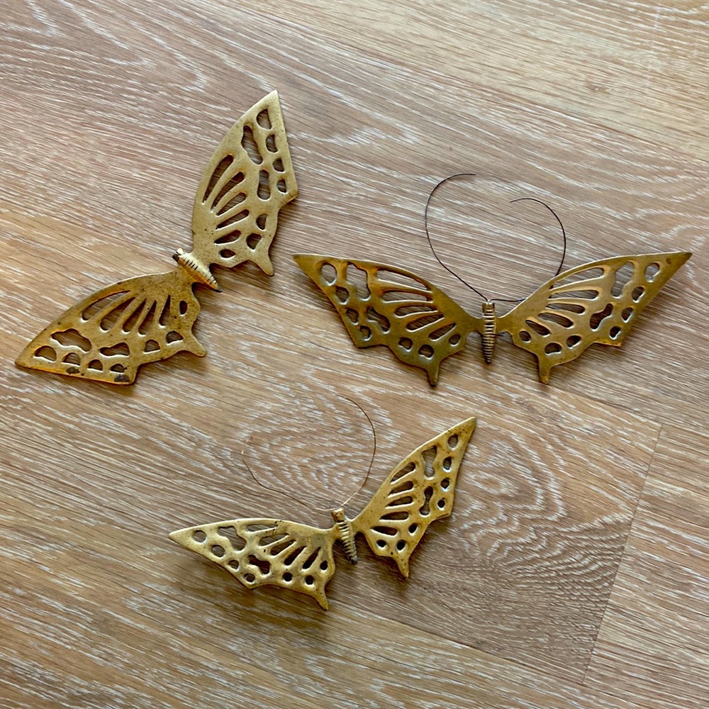 Three brass butterfly’s